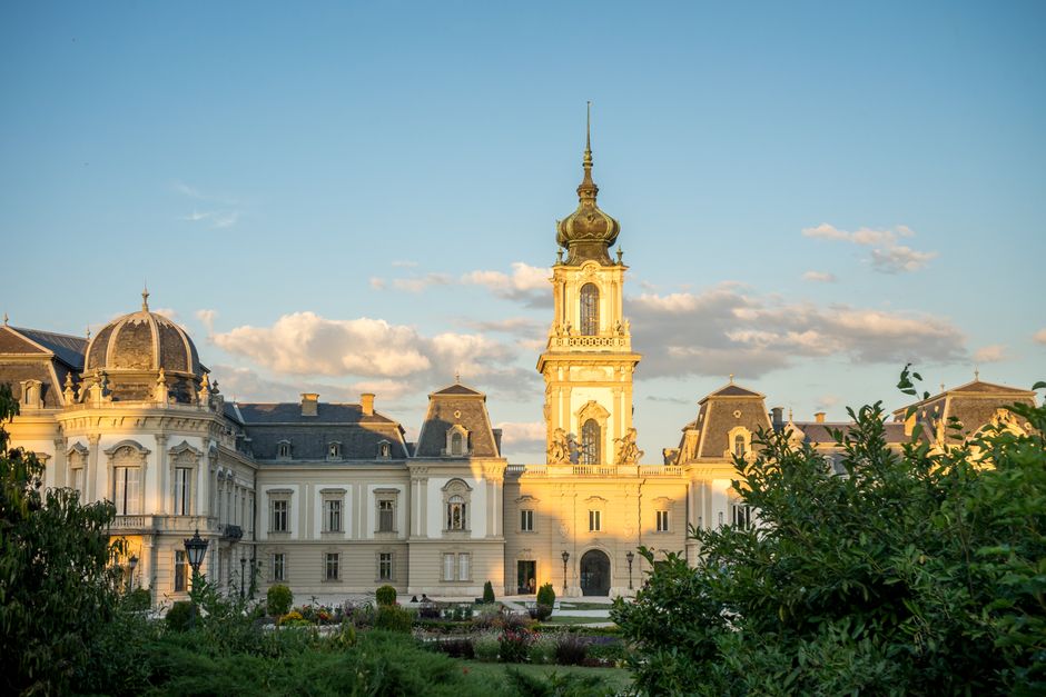 Stunning view of Festetics Palace in Keszthely, Hungary, accented by a golden sunset.