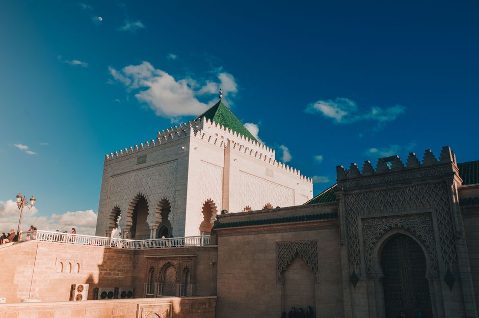 Majestic view of the Mausoleum of Mohammed V against a clear blue sky in Rabat, Morocco.